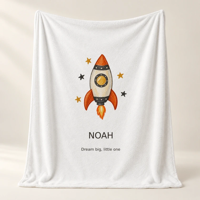 Soft fleece blanket with an orange rocket illustration and the name NOAH